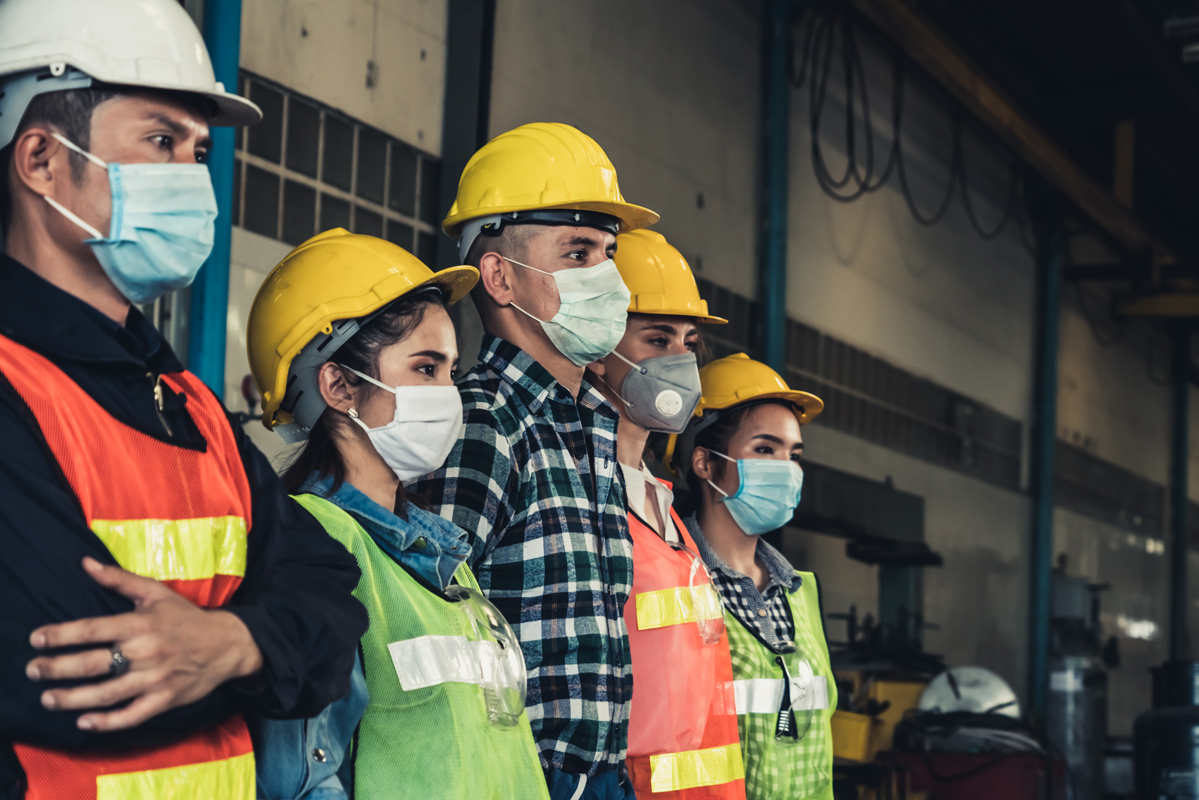 Factory workers with face masks